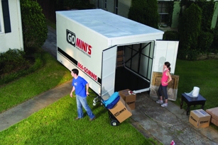 Customers unloading a Go Mini's portable storage container